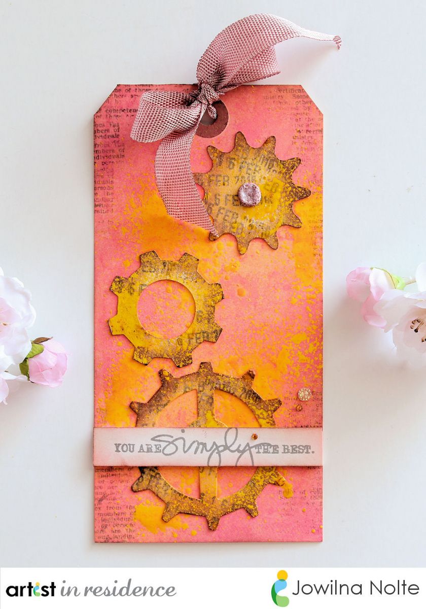 Handmade decorative tag featuring Radiant Neon Ink colors, gear images and a matching ribbon by Jowilna Nolte.