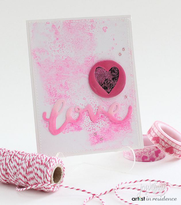 irRESISTible Texture Spray was used to make a textured pink background for this handmade Valentine by Jowilna Nolte.