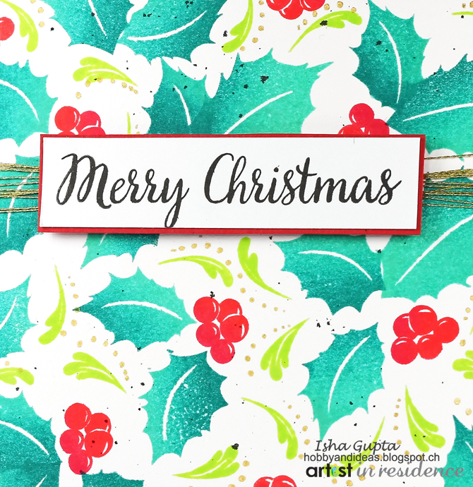 A bright and cheery Chrismas card featuring holly images stamped with Kaleidacolor.