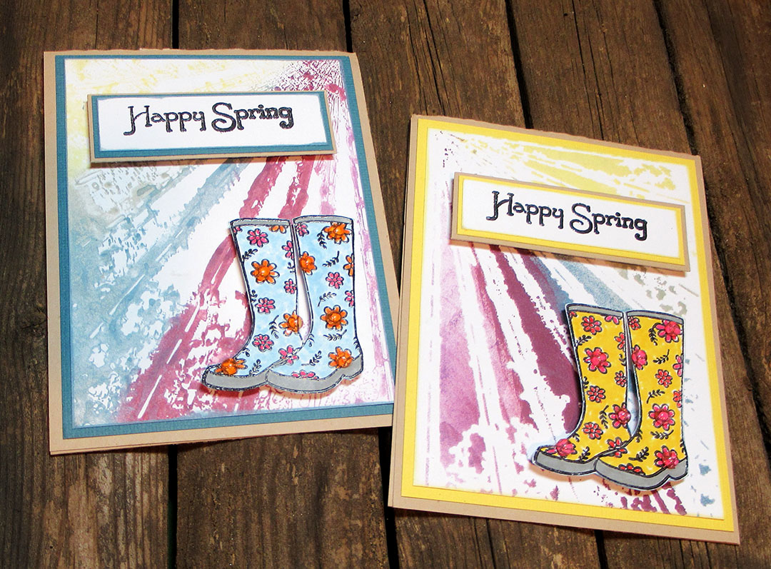 Two spring themed handmade greeting cards featuring rainboot images.