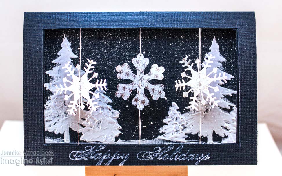 Handmade winter snow themed card featuring spinning snowflakes.
