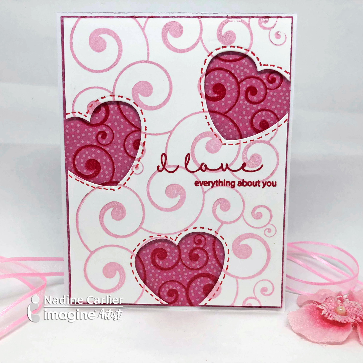Handmade Valentine card featuring two layers with the same stamp and die cut out hearts using the Dewlet Die cut.
