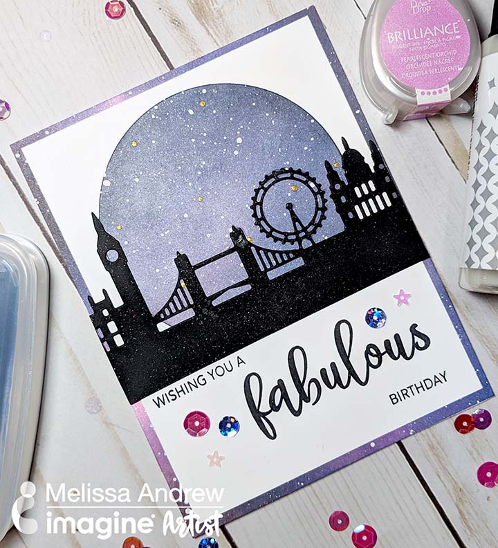Handmade card featuring a blended night sky background and a London skyline silhouette cut out.