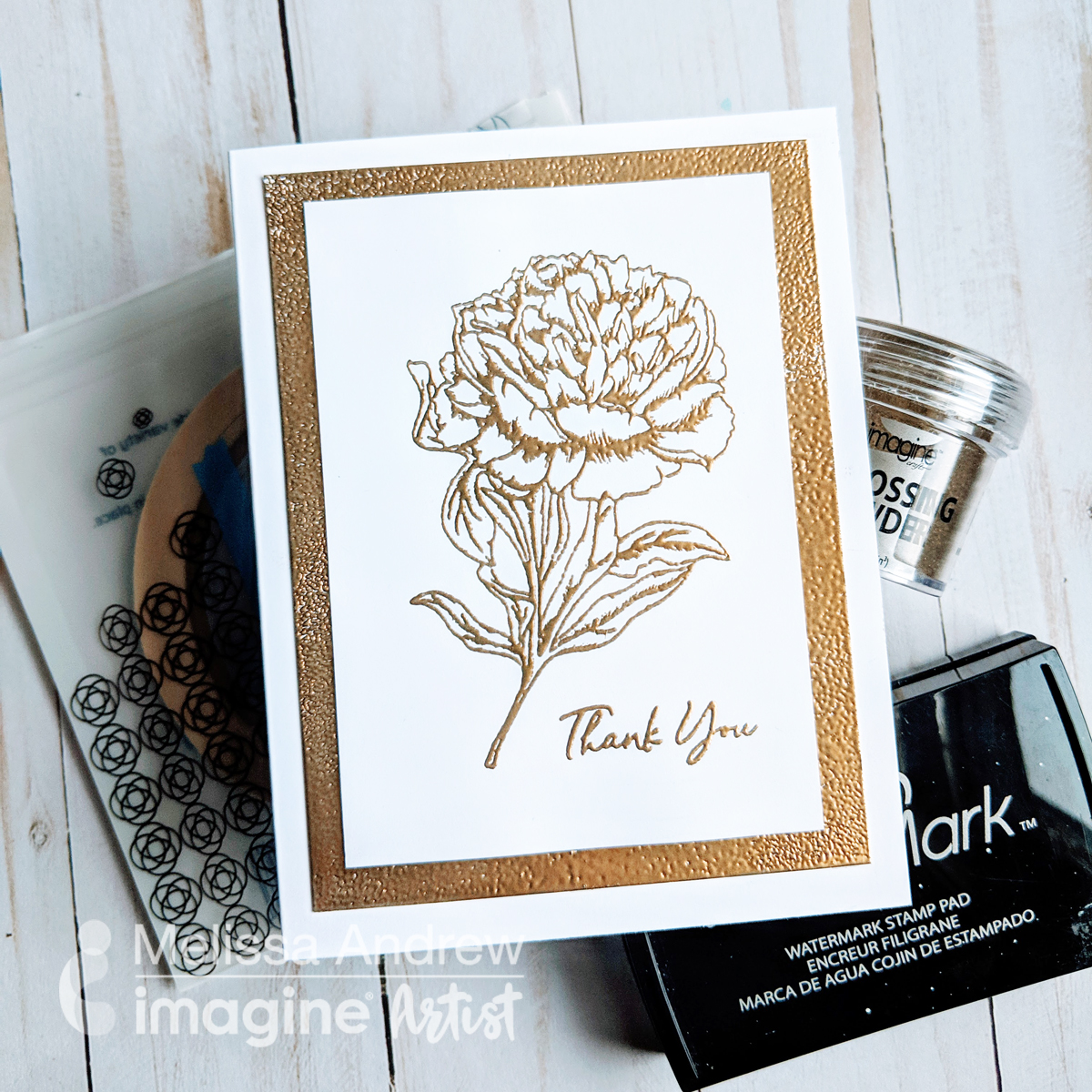 Handmade wedding thank you note featuring gold embossing.