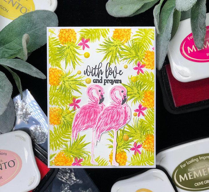 Layered card featuring a flamingo and tropical leaves made using Memento with layering stamps.